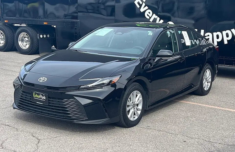 A black 2025 Toyota Camry LE sedan